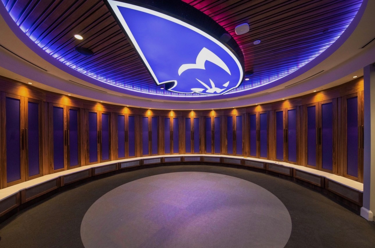 HPU Panthers women's basketball locker room with illuminated Panther logo on the ceiling